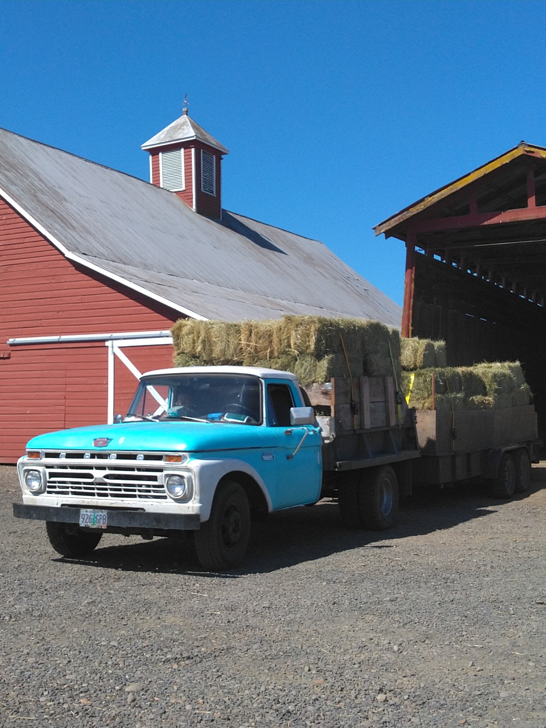 Truck and trailer hauling hay